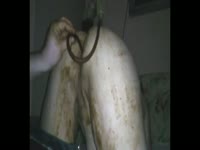 Extreme scat fetish movie features bent over whore taking anal insertion covered in poop